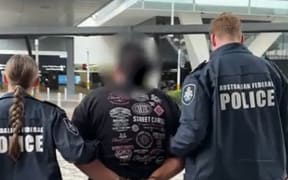 A NZ man has been charged with trying to import $10 million of heroin to Sydney in floral-patterned bags.