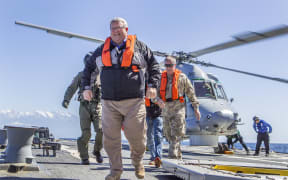 Gerry Brownlee and Tim Keating arrive on the USS Sampson.