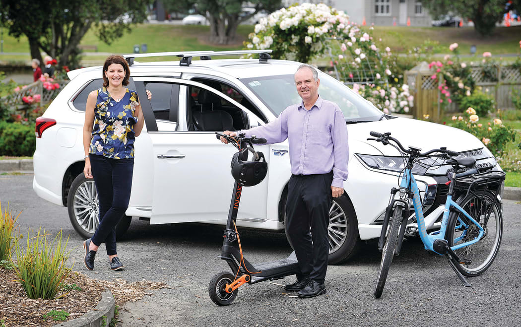 Rehette Stoltz with the new mayoral car – a Mitsubishi Outlander hybrid – and Gisborne District Council asset manager Simon Jeune with one of the council’s e-scooters and an e-bike, which are part of a drive to get the council moving in an environmentally friendly way