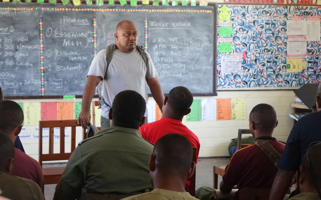 Commander Humphrey Tawake addresses troops at the command post on Vanua Balavu, Fiji
