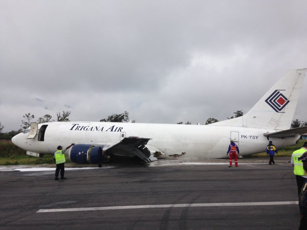 The Trigana 737 aircraft skidded for a kilometre on its belly along the runway before coming to rest to the side of the strip.