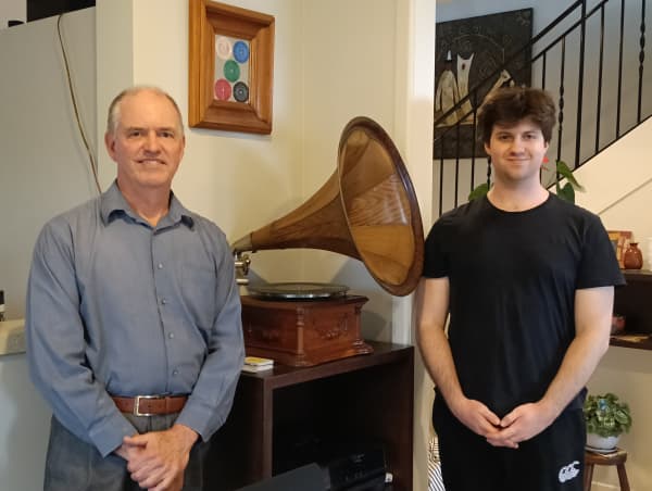 University of Auckland professor of chemical sciences Paul Kilmartin and son Sasha with his 1905 gramophone.