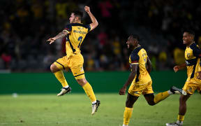 Mikael Doka of the Mariners (left) celebrates with teammates after scoring a goal in stoppage time during the A-League Men Round 23 match between the Central Coast Mariners and Wellington Phoenix at Industree Group Stadium in Gosford.