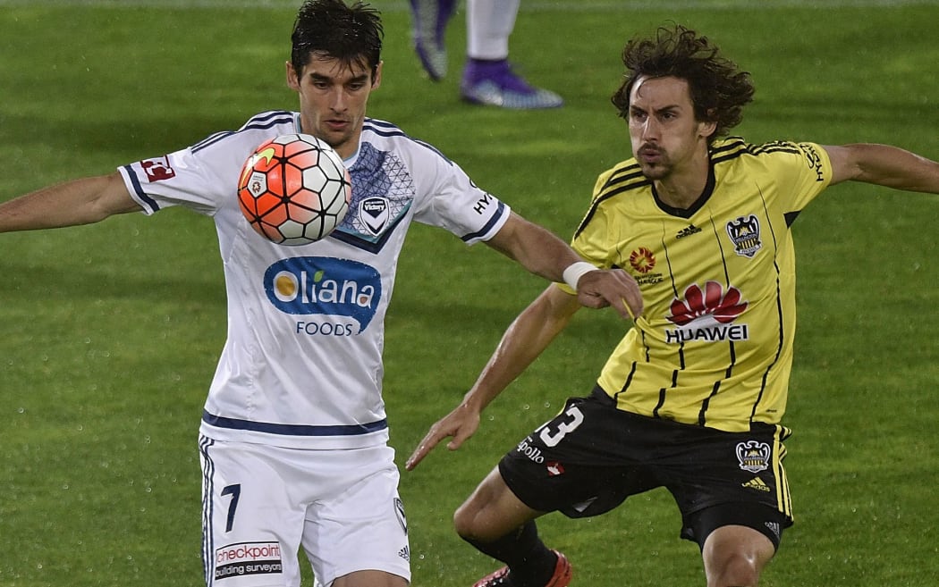 The Victory's Gui Finkler (L) takes a pass in front of Albert Riera.