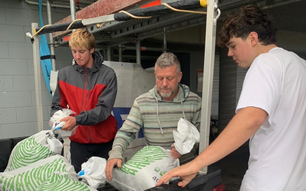 Sandbagging the Waihi Beach Surf Club.