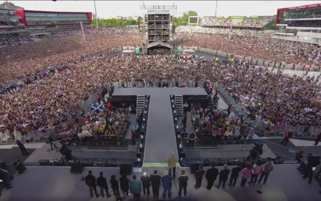 Those gathered at the One Love Manchester benefit concert have a minute's silence before the concert begins.