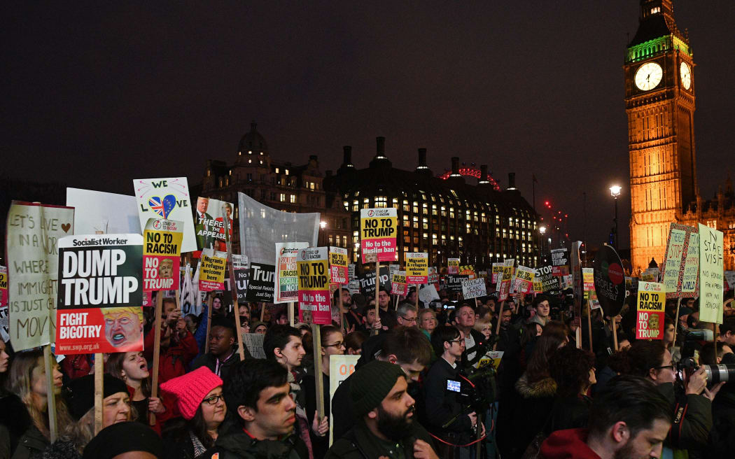 Protesters outside the British parliament as MPs debate  whether Donald Trump's state visit should be blocked.
