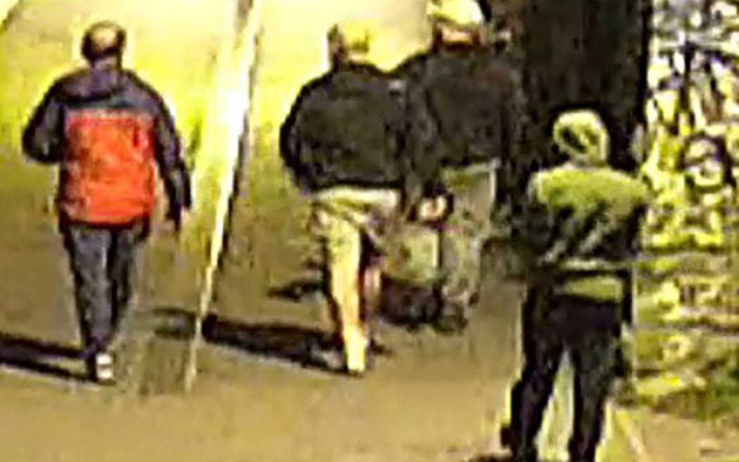 This handout image of CCTV footage released by Avon and Somerset Police on 11 December, 2025 shows men carrying bags in the early hours of 25 September in the city of Bristol, south-west England outside a building which housed items from the Bristol Museum’s British Empire and Commonwealth collection.