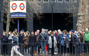 Commuters walk to work as London Underground services are severely disrupted due to members of RMT and TSSA unions start a 24-hour strike action in a dispute over jobs cuts and closed ticket offices on January 9, 2017.