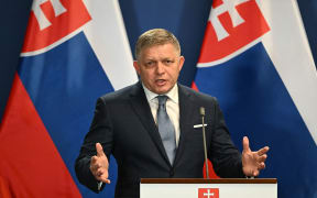 (FILES) Slovakia's Prime Minister Robert Fico gestures as he addresses a press conference with his Hungarian counterpart at Carmelita monastery in Budapest on January 16, 2024. Slovak Prime Minister Robert Fico was on May 15, 2024 shot and hospitalised after a cabinet meeting in the central town of Handlova, local media said. (Photo by ATTILA KISBENEDEK / AFP)