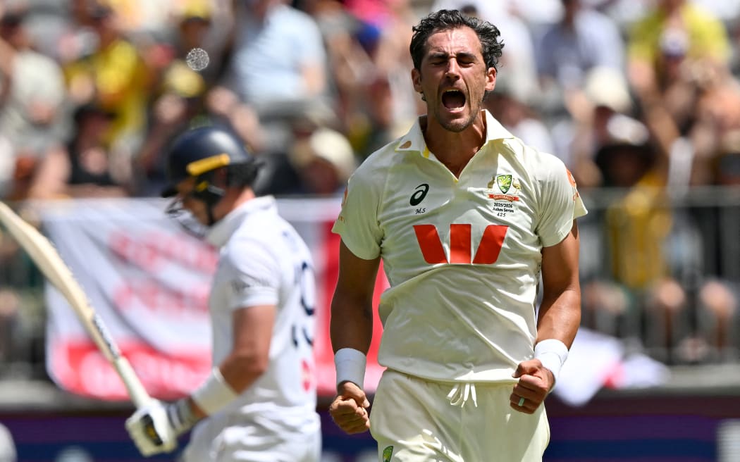 Australia’s Mitchell Starc celebrates his fifth wicket on day 1 of the first Ashes cricket Test match between Australia and England at Perth Stadium in Perth on November 21, 2025. (Photo by Saeed KHAN / AFP) / -- IMAGE RESTRICTED TO EDITORIAL USE - STRICTLY NO COMMERCIAL USE --