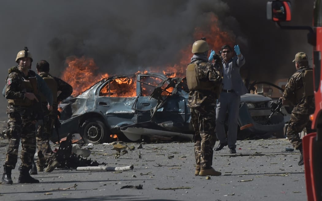 Afghan security forces personnel are seen at the site of a car bomb attack in Kabul on May 31, 2017.