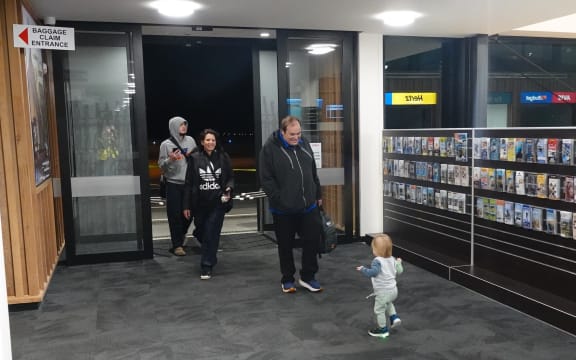 The first passenger off Barrier Air’s inaugural flight to Kerikeri, Chris Hoffmann, receives a warm welcome at Bay of Islands Airport.