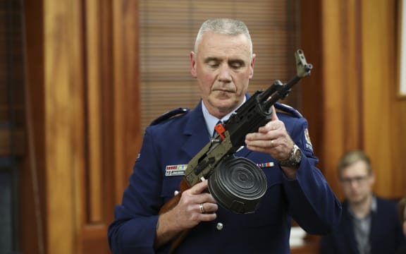 Police officer Paddy Hennan demostrates illegal gun modifications
