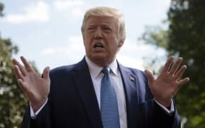 US President Donald Trump speaks to the press as he departs the White House in Washington, DC, for his annual visit to Walter Reed National Military Medical Center, on October 4, 2019.
