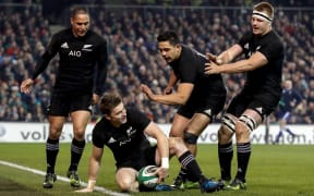 Beauden Barrett celebrates scoring a try against Ireland in Dublin.