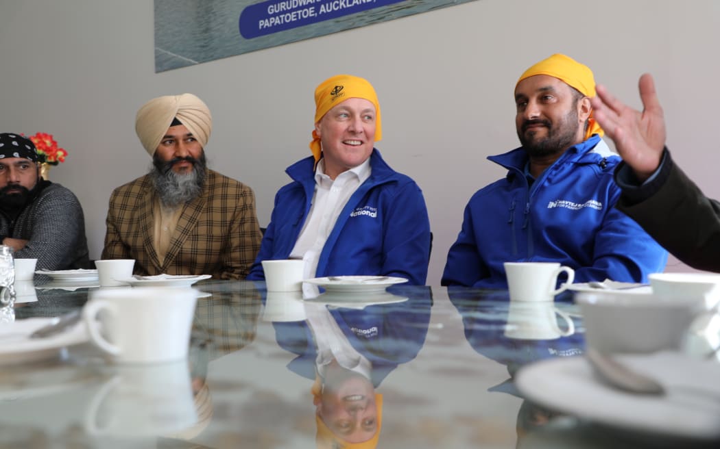 National Party leader Christopher Luxon (second right) on the campaign trial in the Auckland suburb of Papatoetoe on 13 September 2023.
