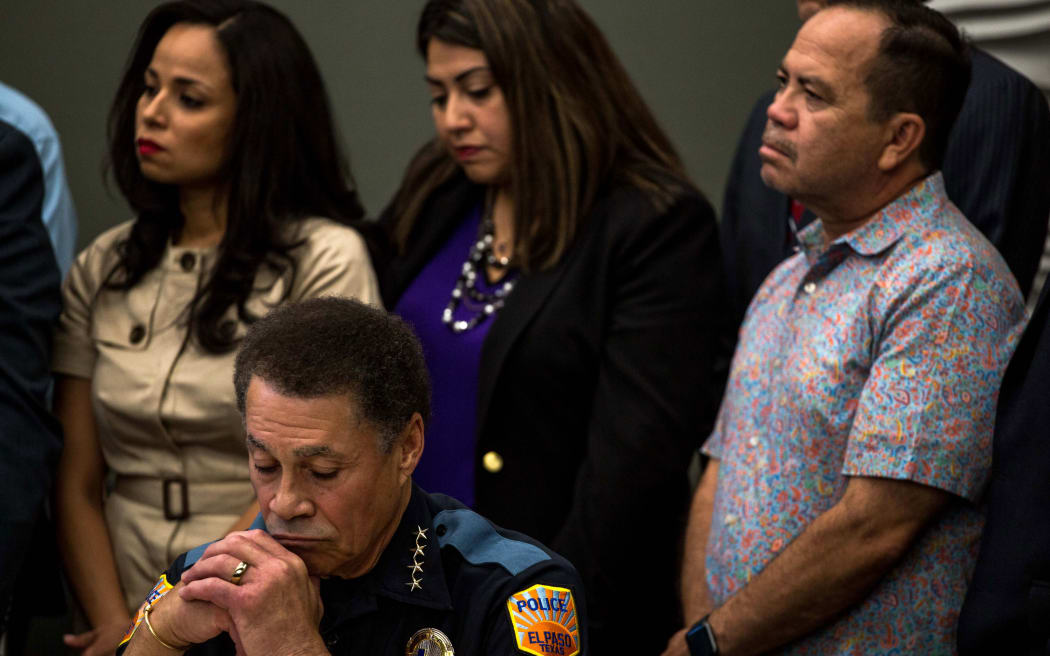 El Paso Police Chief Greg Allen (L) listens during a press briefing, following a mass fatal shooting, at the El Paso Regional Communications Center in El Paso, Texas, on August 3, 2019.