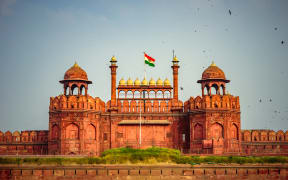 Red Fort is a historic fort UNESCO World Heritage Site at Delhi. On Independence day, the Prime Minister hoists Indian flag at main gate of fort & delivers nationally broadcast speech from its rampart