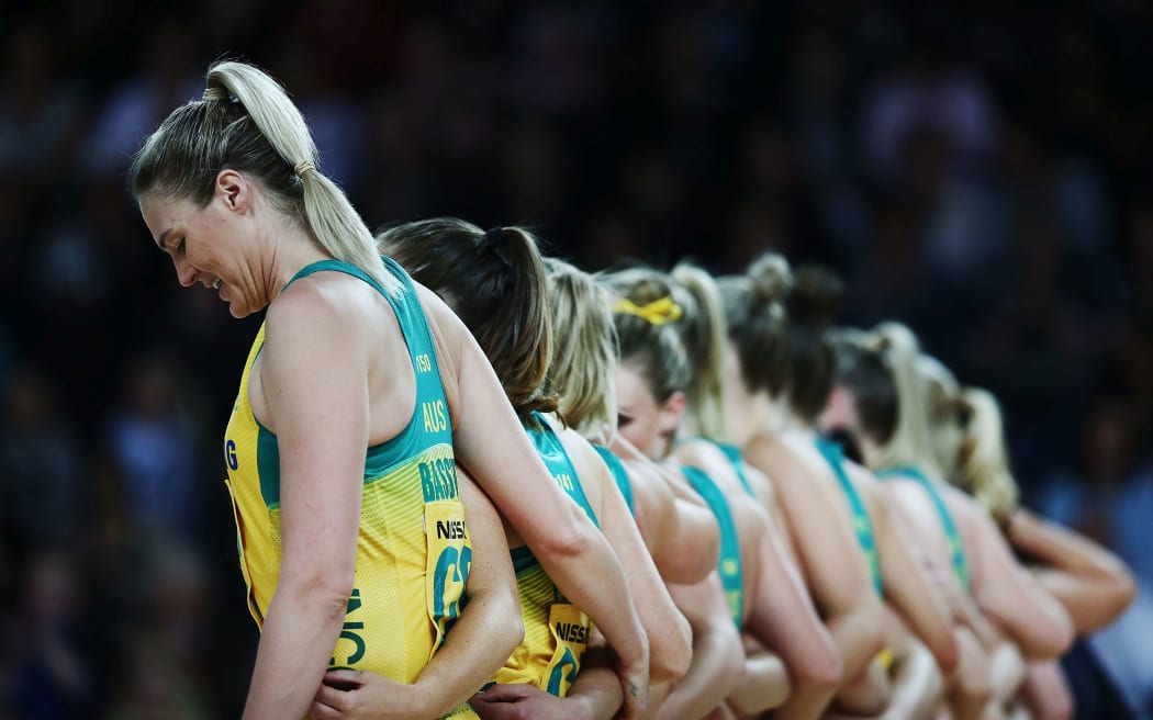 Caitlin Bassett of Australia lines up with the team during the national anthems.