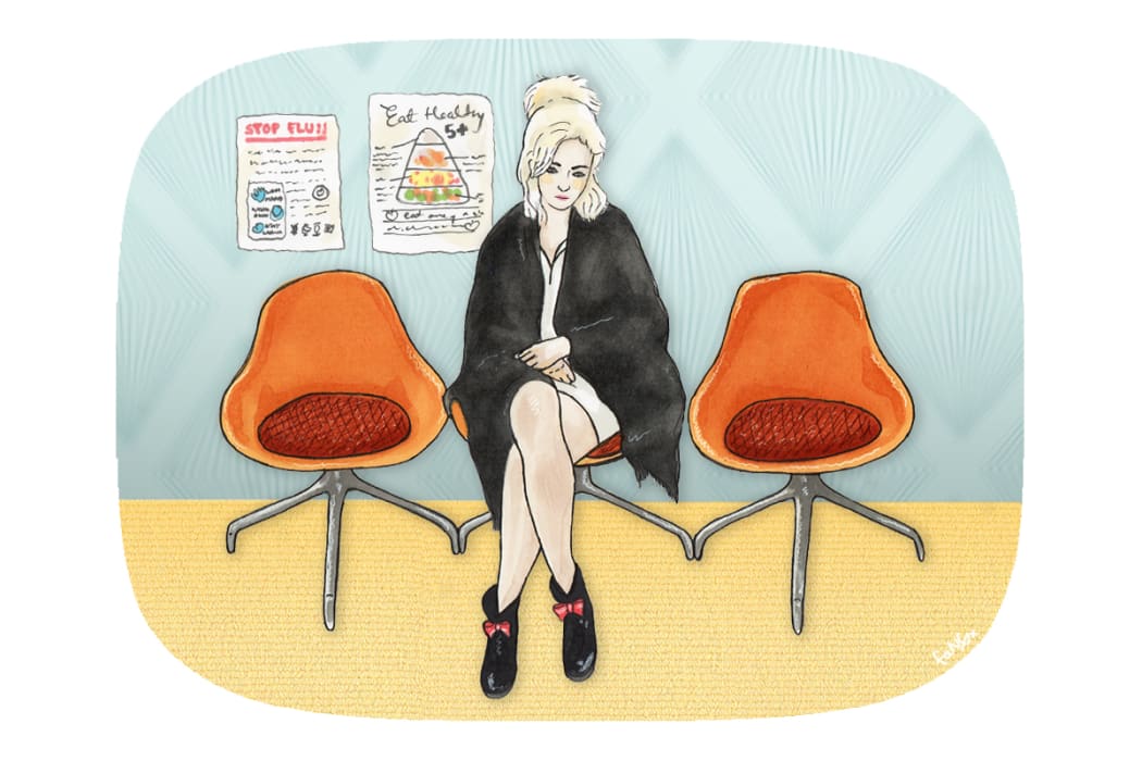 A young woman in a doctor's office waiting room.