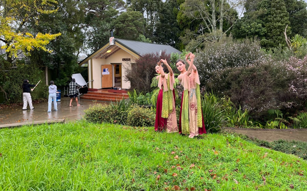 Visitors dressed in traditional clothing worn by Han Chinese attend a Matariki festival in Auckland's Howick neighborhood.