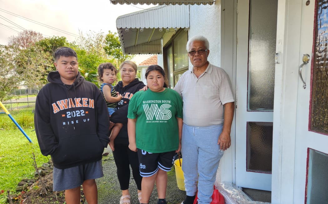 Lesieli Aholelei-Yitiri (second from left), with some of her family outside their home in Wesley next to the Oakley Creek.