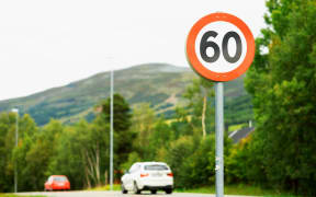60km/h speed limit road sign.