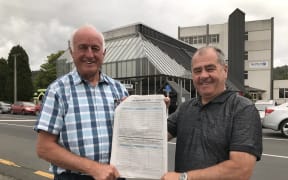 Democracy Northland campaigners John Bain (left) and Robin Grieve (right) are spearheading New Zealand's biggest Māori wards opposition polling demand campaign outside Northland Regional Council's head office in Whangārei.