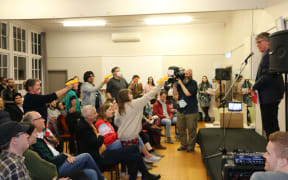 Aro Valley debate attendees practice their water pistol skills.
