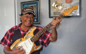 Dennis Marsh with one of his prized guitars.