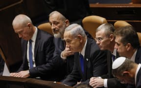 Israel's Prime Minister Benjamin Netanyahu and members of his new cabinet look on during the government's swearing in session at the Knesset in Jerusalem.