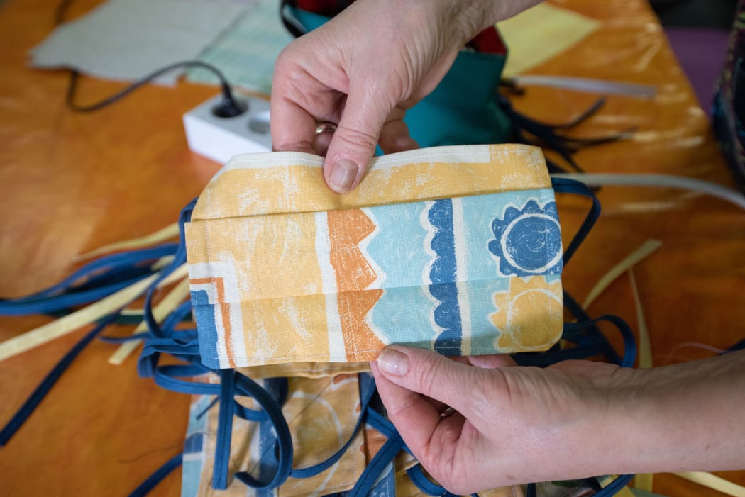 Volunteers in Dordogne, France, make fabric masks, 30 April 2020.