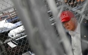 US President President Donald Trump visits a migrant detention center, dubbed "Alligator Alcatraz," located at the site of the Dade-Collier Training and Transition Airport in Ochopee, Florida on July 1, 2025. President Trump is visiting a migrant detention center in a reptile-infested Florida swamp dubbed "Alligator Alcatraz," a 5,000-bed facility -- located at an abandoned airfield in the Everglades wetlands -- part of his expansion of deportations of undocumented migrants, his spokeswoman said. (Photo by ANDREW CABALLERO-REYNOLDS / AFP)