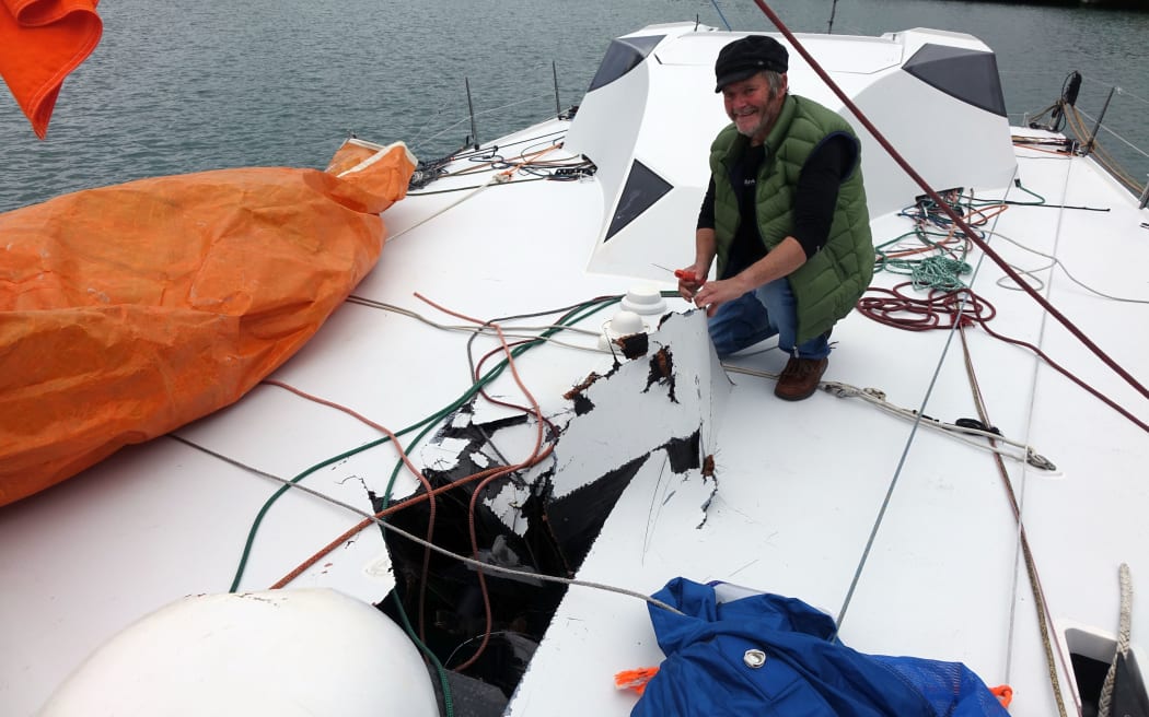 Yachtsman Enda O'Coineen with the damage to his yacht, the Kilcullen Voyager.