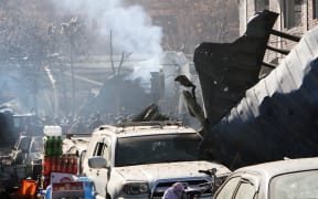 Afghan security officials inspect the blast side in Kabul. Afghanistan on January 27, 2018. 





 Haroon Sabawoon / Anadolu Agency
