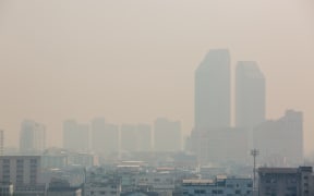 Office building under smog in Bangkok. Smog is a kind of air pollution. Bangkok City in the air pollution.