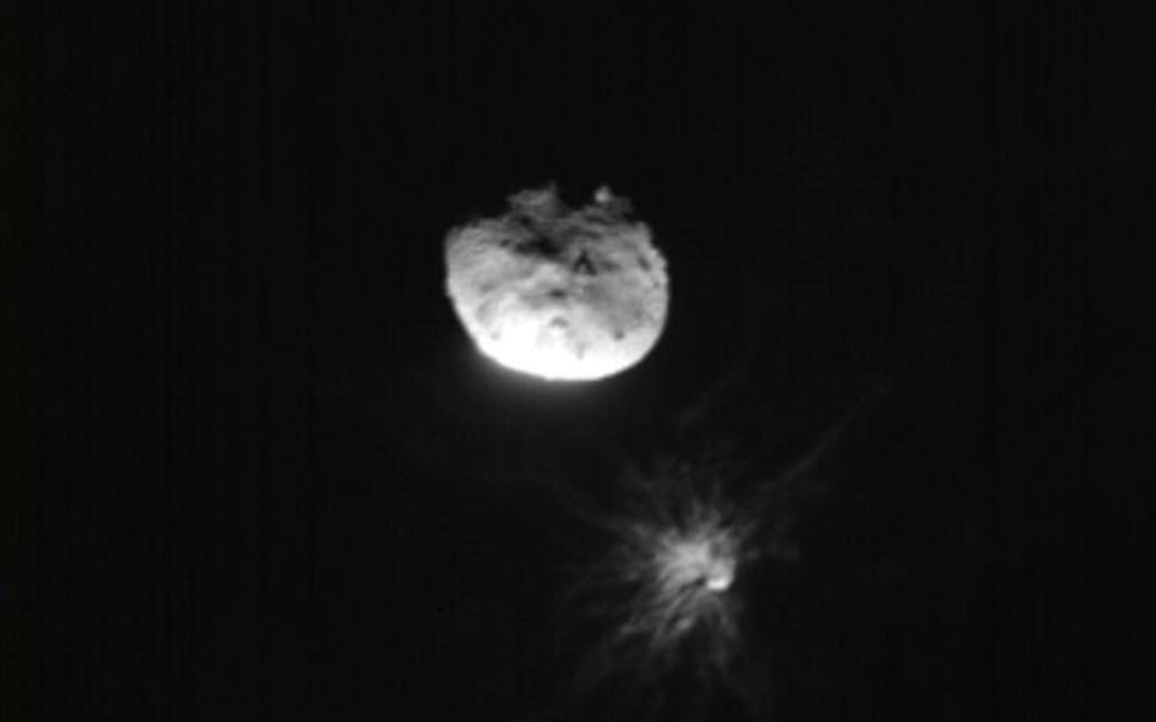This handout picture obtained by the Italian Space Agency’s LICIACube shows the NASA's Double Asteroid Redirection Test (DART) mission just before its closest approach to the Dimorphos asteroid, on September 26, 2022. NASA's DART spaceship struck the moonlet asteroid Dimorphos, in a historic test of humanity's ability to prevent a cosmic object devastating life on Earth. (Photo by Handout / ASI/NASA / AFP) / RESTRICTED TO EDITORIAL USE - MANDATORY CREDIT "AFP PHOTO / ASI/NASA" - NO MARKETING NO ADVERTISING CAMPAIGNS - DISTRIBUTED AS A SERVICE TO CLIENTS