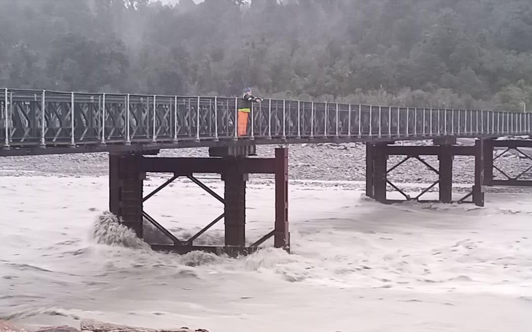 Flood level monitoring by radar gun on the Waiho River Bridge at Franz Josef by West Coast Regional Council Staff.