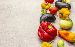 Trendy ugly organic vegetables. Assortment of fresh pepper, eggplant, cucumber, tomato, pumpkin. Cooking ugly food concept. Stone concrete background, copy space