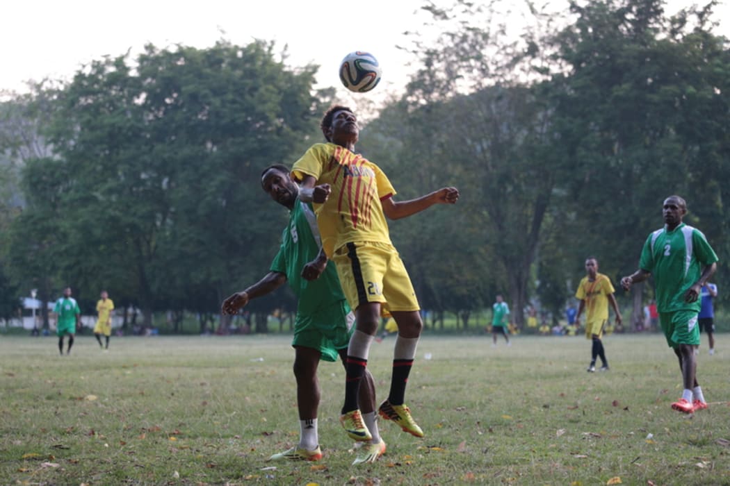 Persipura Jayapura (green) at practice.