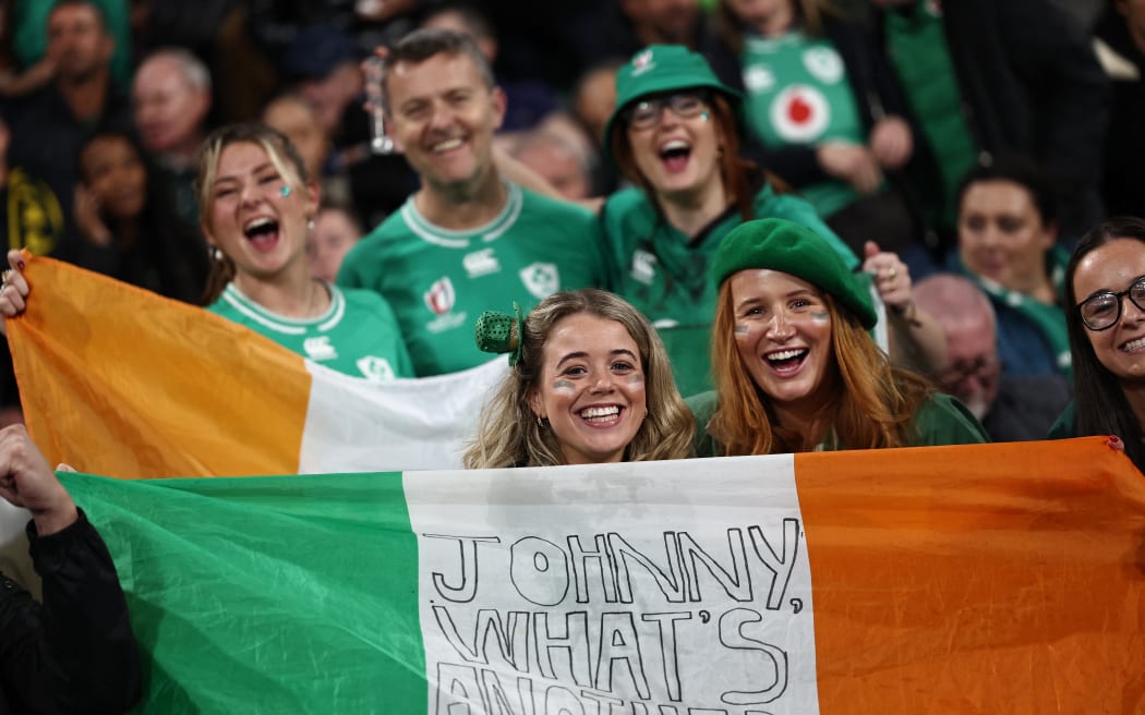 Ireland's supporters cheer in the stands with national flags ahead of the France 2023 Rugby World Cup quarter-final match between Ireland and New Zealand at the Stade de France in Saint-Denis, on the outskirts of Paris, on October 14, 2023.