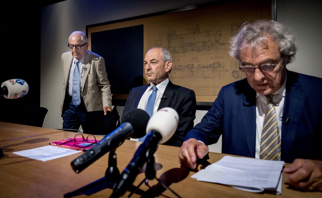 Former Ajax football club physiotherapist and holocaust victim Salo Muller (L), chairman of a commission that proposed reparations Job Cohen (C) and president director of the Dutch national rail company NS Roger van Boxtel (R) in Utrecht on June 26, 2019.