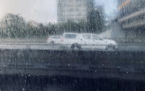 Cars on motorway in Auckland after wild weather hit the city on 3 August 2021.