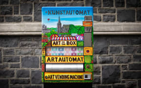 Kunstautomat has been installed at the Arts Centre in Christchurch. In exchange it gives out a small piece of art