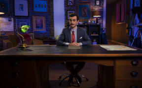 Robbie Nicol. The White Man Behind A Desk.