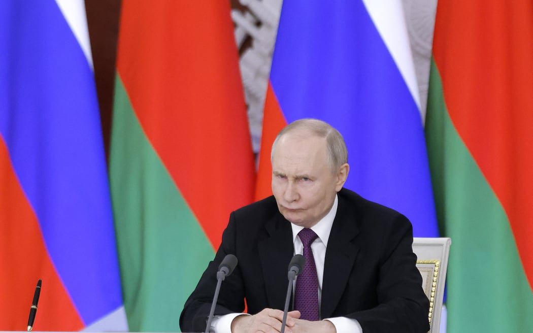 Russia's President Vladimir Putin reacts during a press conference following a meeting with his Belarusian counterpart at the Kremlin in Moscow on March 13, 2025. (Photo by Maxim Shemetov / POOL / AFP)