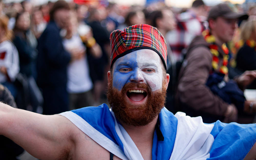 A Scottish football fan reacts as he watches the UEFA Euro 2024 opening football match between Germany and Scotland