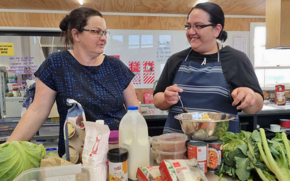 Waitara Pataka Kai manager Amy Olsen with student solo mum of two Nikita Dravitski.