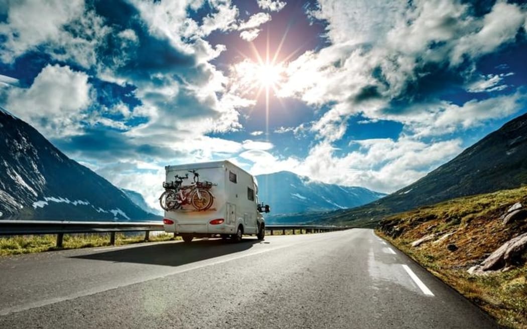 Caravan car travels on the highway.